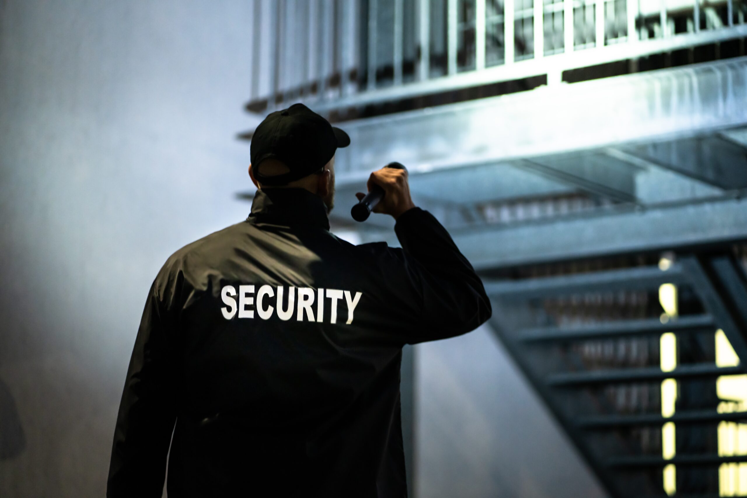 security guard patrolling with flashlight