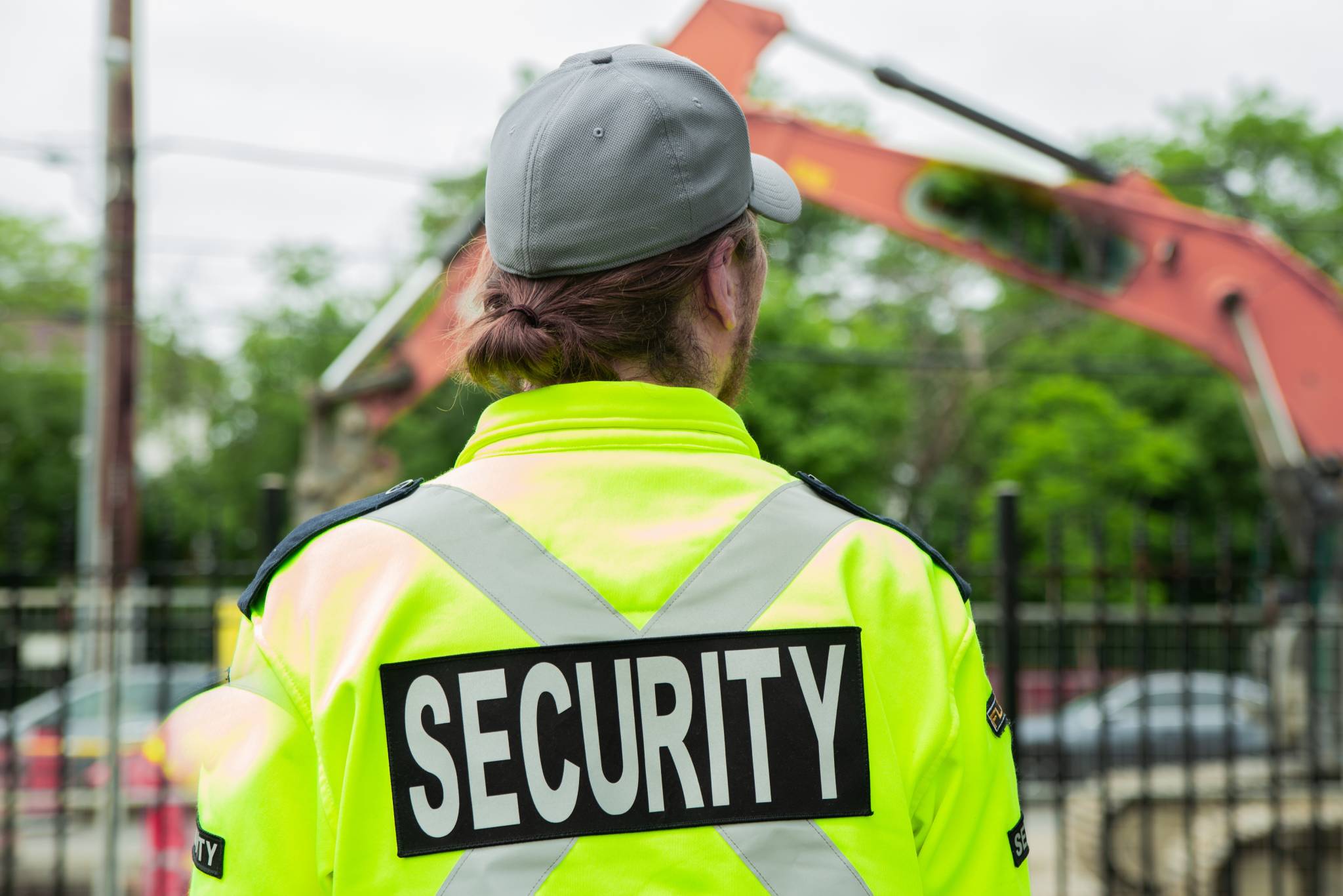 Security guard watching construction site on the street